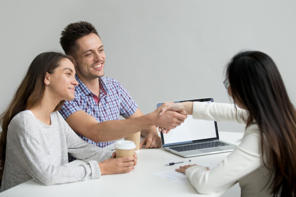 happy customer couple greeting marketing consultant